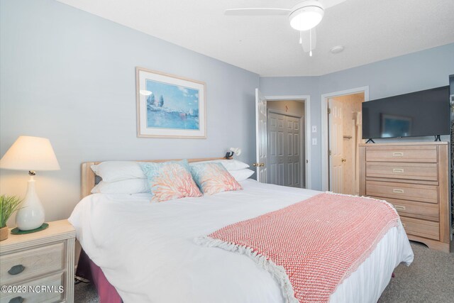 carpeted bedroom featuring a closet and ceiling fan