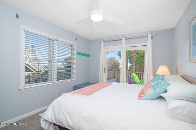 carpeted bedroom featuring ceiling fan and access to outside