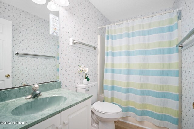 full bathroom featuring vanity, toilet, shower / tub combo with curtain, and hardwood / wood-style floors