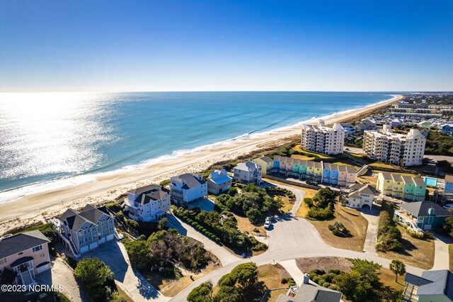 birds eye view of property featuring a view of the beach and a water view