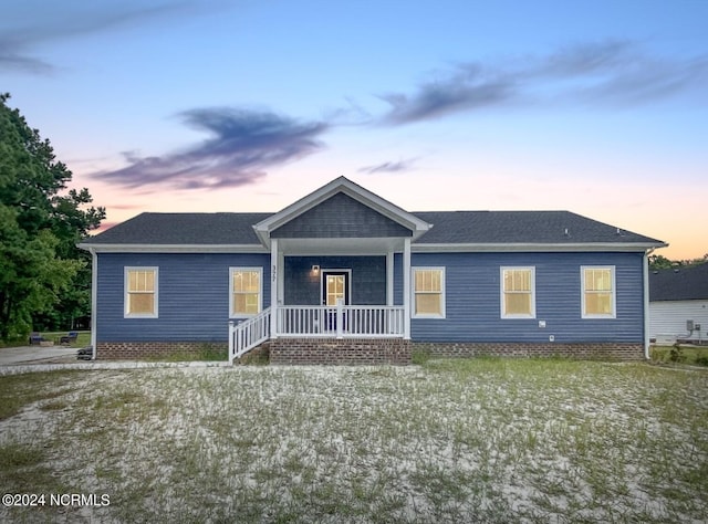 view of front of property featuring covered porch