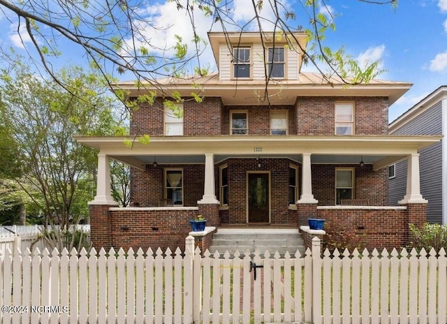 1222 National Ave, New Bern, NC 28560 - traditional style home with a porch, brick siding, and a fenced front yard