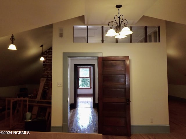 1222 National Ave, New Bern, NC 28560 - entryway with a chandelier, vaulted ceiling, and wood finished floors