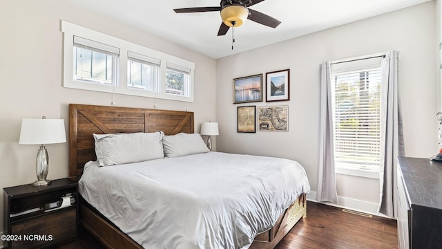 bedroom featuring ceiling fan and dark hardwood / wood-style flooring