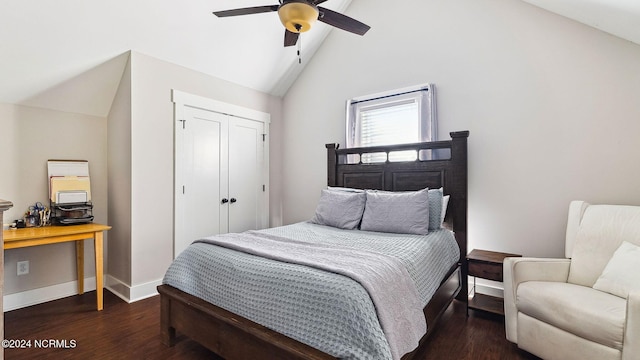 bedroom featuring a closet, wood finished floors, baseboards, ceiling fan, and vaulted ceiling