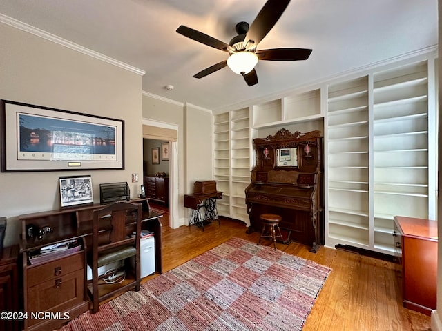 office with ceiling fan, ornamental molding, and hardwood / wood-style floors