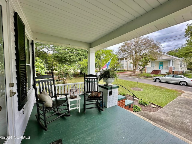 exterior space with a lawn and covered porch