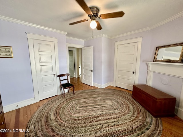 207 W Eden St, Edenton, NC 27932 - sitting room with wood finished floors, a ceiling fan, baseboards, and crown molding