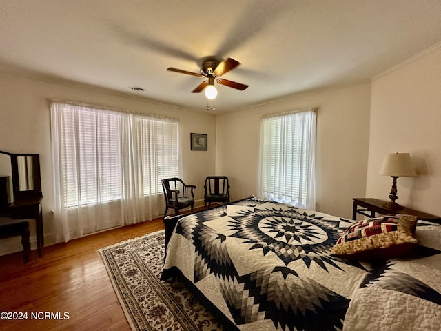 207 W Eden St, Edenton, NC 27932 - bedroom featuring wood finished floors, crown molding, and a ceiling fan