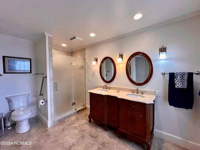 bathroom featuring ornamental molding, vanity, a shower with shower door, and toilet