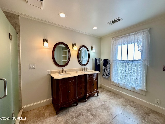 bathroom featuring ornamental molding, a shower with shower door, and vanity