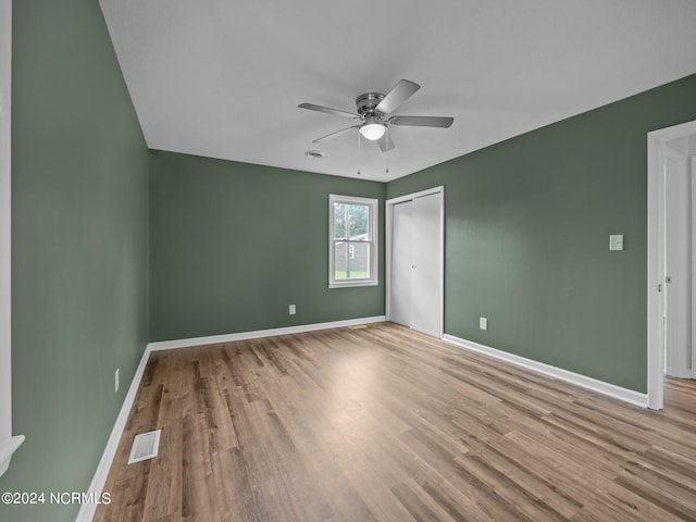 unfurnished room with ceiling fan and light hardwood / wood-style floors