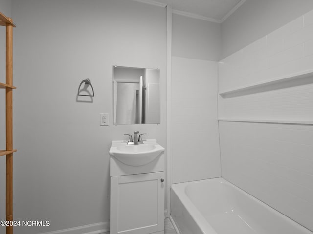 bathroom with shower / tub combination, vanity, and crown molding