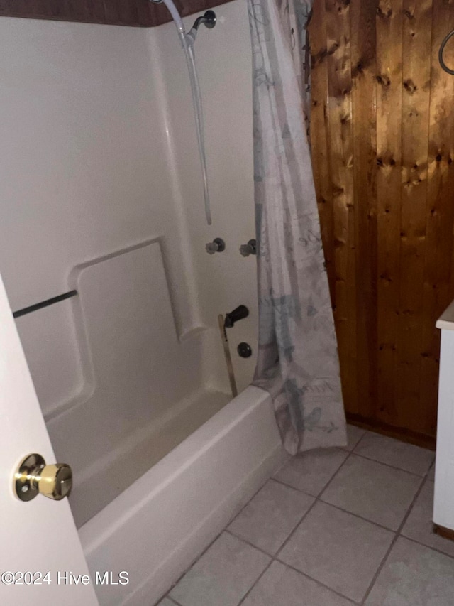 bathroom featuring tile patterned floors and shower / bathtub combination with curtain