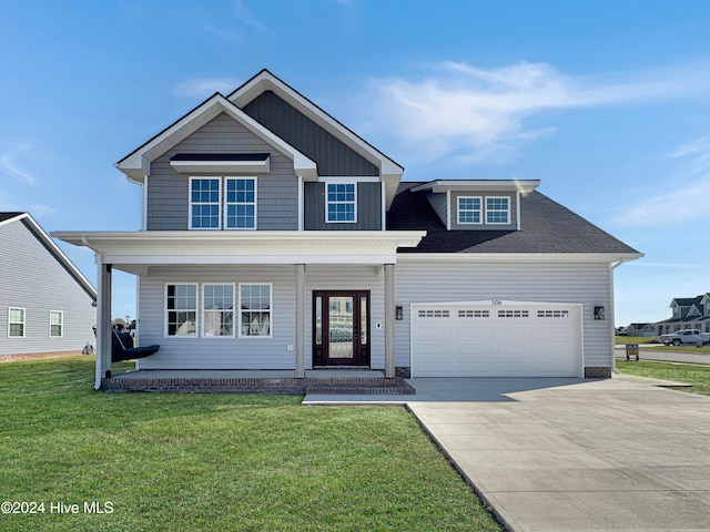 view of front facade featuring a front yard and a garage