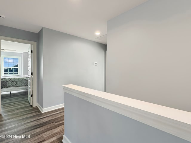 hallway featuring dark hardwood / wood-style flooring