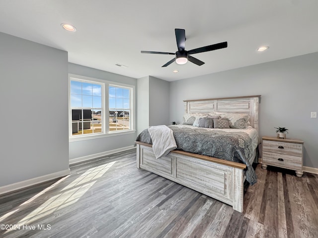 bedroom with wood-type flooring and ceiling fan