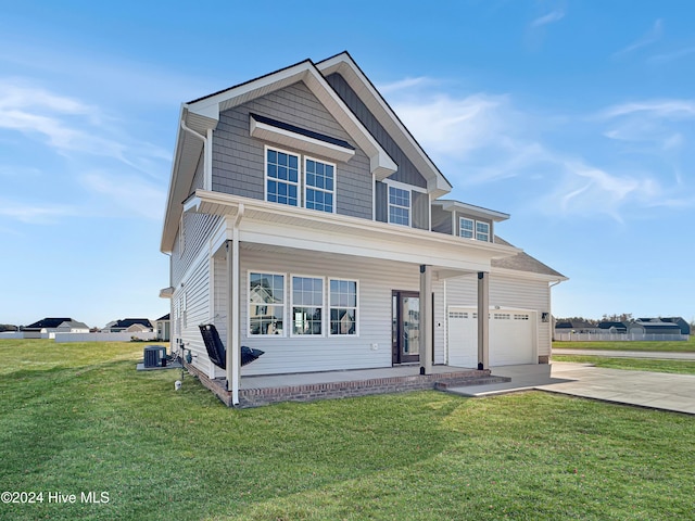 view of front facade featuring central AC unit, a garage, and a front lawn