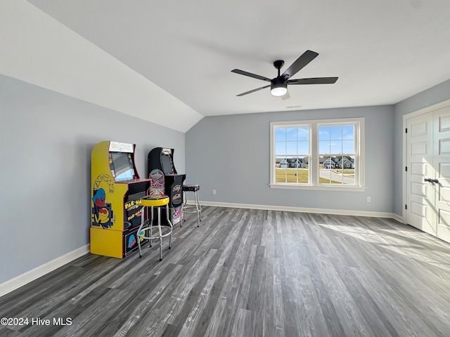 home office featuring ceiling fan, wood-type flooring, and vaulted ceiling