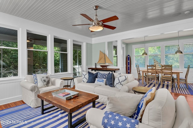 sunroom / solarium with ceiling fan