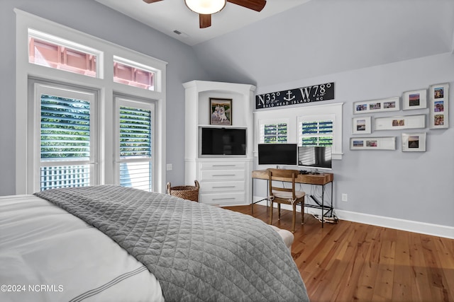 bedroom with wood-type flooring, vaulted ceiling, and ceiling fan