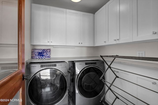 clothes washing area featuring washing machine and dryer