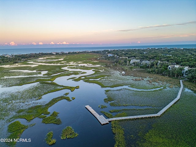 aerial view at dusk with a water view