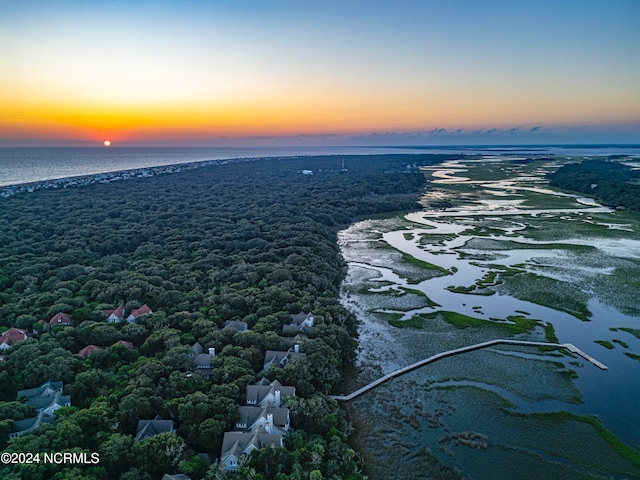 aerial view at dusk with a water view