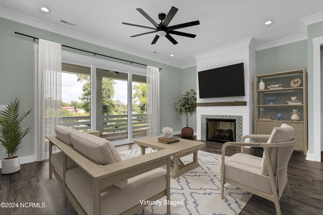 living room with crown molding, dark hardwood / wood-style floors, and ceiling fan