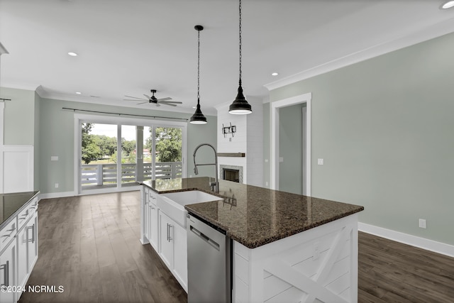 kitchen featuring white cabinetry, sink, dishwasher, and a kitchen island with sink