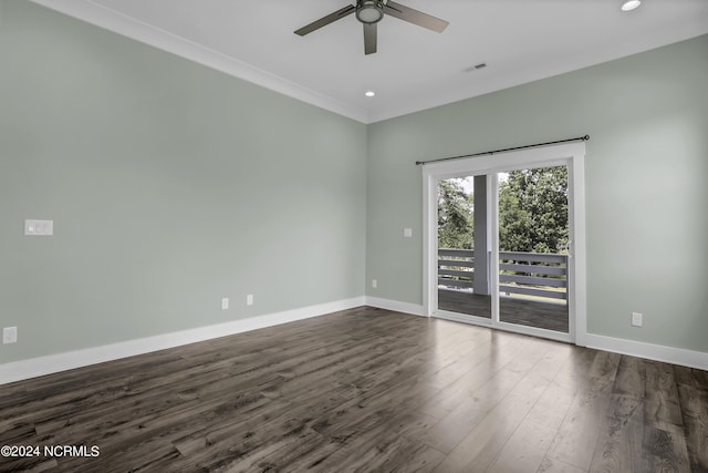 empty room with crown molding, dark wood-type flooring, and ceiling fan