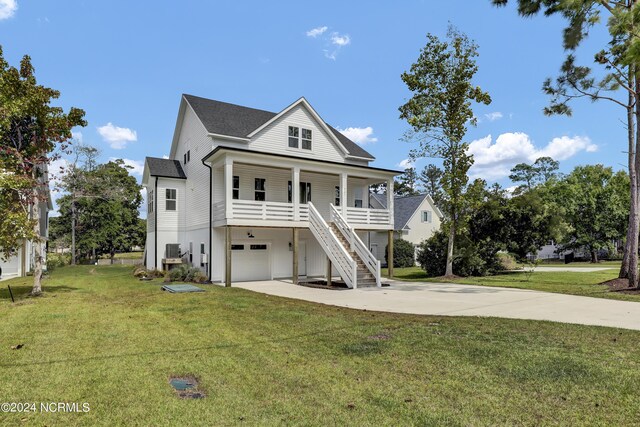 back of property with a patio and a yard