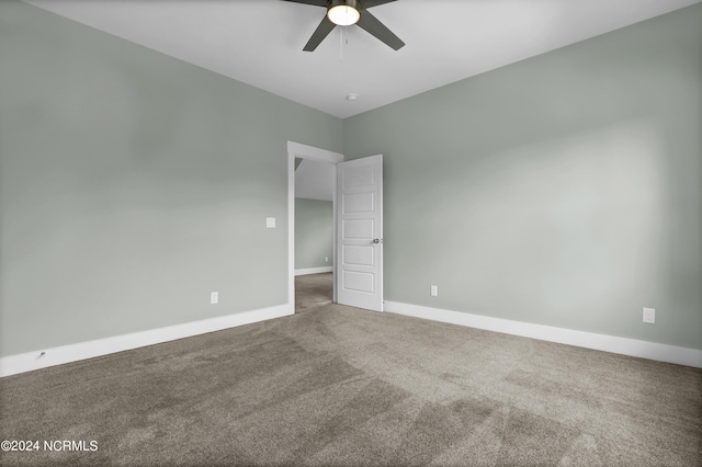 carpeted empty room with ceiling fan