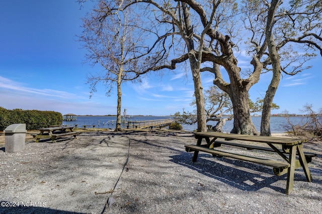 view of community with a water view