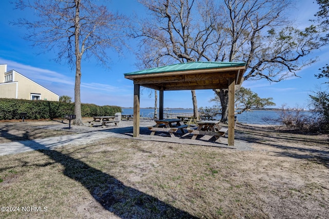 exterior space featuring a gazebo and a water view