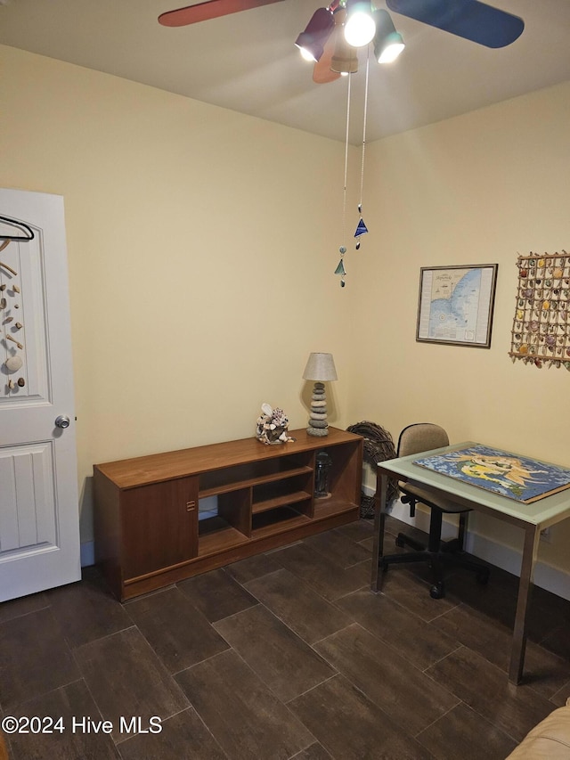 dining room with dark hardwood / wood-style flooring and ceiling fan