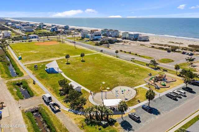 birds eye view of property featuring a view of the beach and a water view