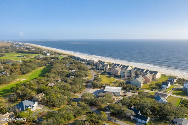 birds eye view of property featuring a water view and a beach view