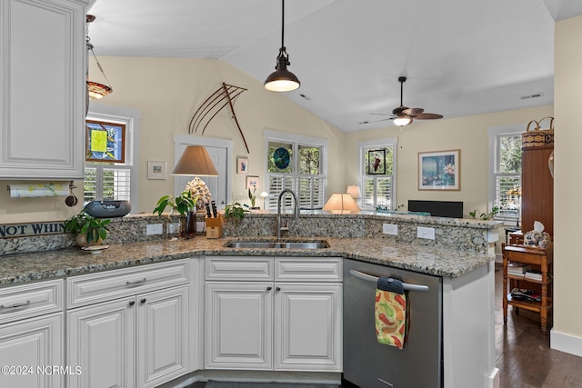 kitchen featuring dishwasher, white cabinets, lofted ceiling, and sink