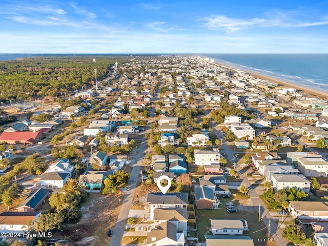 aerial view featuring a water view and a beach view