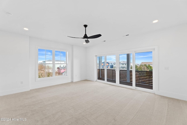 carpeted empty room with ceiling fan