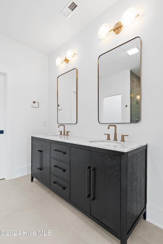 bathroom with tile patterned flooring and vanity