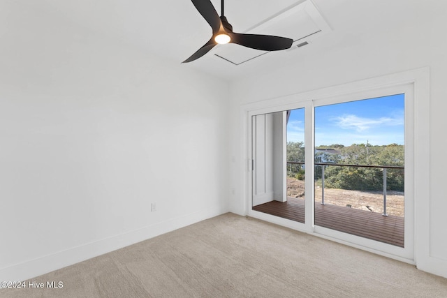 spare room featuring ceiling fan and light colored carpet