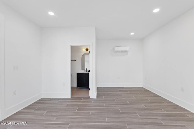 empty room featuring an AC wall unit