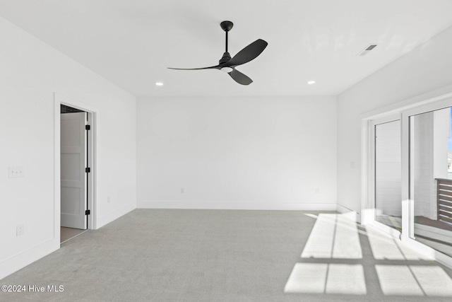 interior space with light carpet and ceiling fan