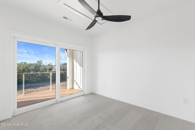 empty room featuring carpet floors and ceiling fan