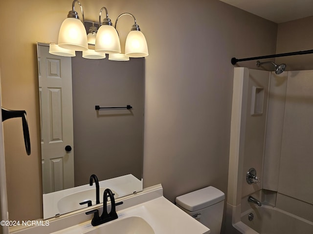 full bathroom featuring vanity, washtub / shower combination, and toilet