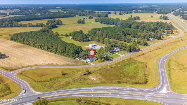 birds eye view of property featuring a rural view