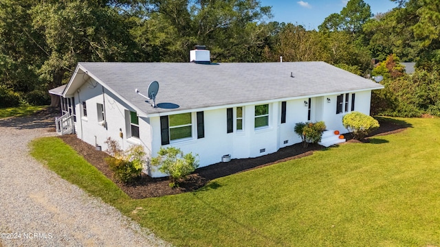 back of house featuring a yard