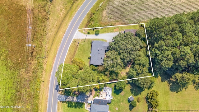 birds eye view of property with a rural view